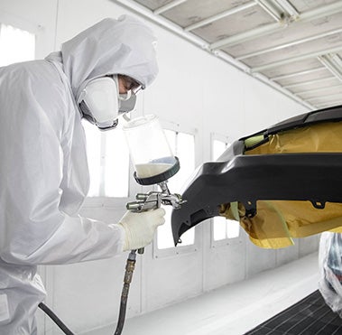 Collision Center Technician Painting a Vehicle | Stone Mountain Toyota in Lilburn GA